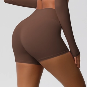Detailed view of high-waist yoga shorts in brown with seamless contouring design