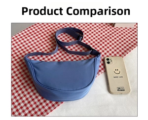 Blue nylon crescent bag shown with smartphone for size comparison on checked cloth