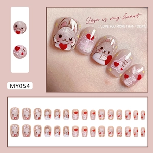Cat-eye press-on nails with cute bunny, heart, and letter patterns in pink glitter