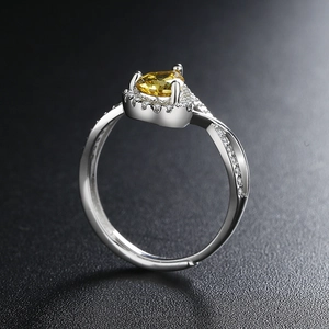 Water drop yellow zircon open ring with silver pave rhinestones on black background
