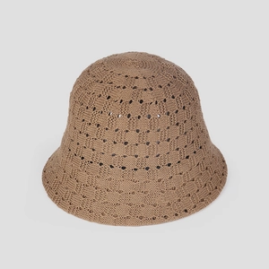 Detail of hand-woven hollow knit fisherman hat showing breathable texture and khaki color