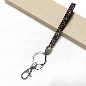 Crystal rhinestone keychain lanyard with metal ring and spring clasp on white backdrop