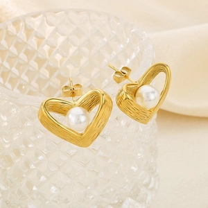 French vintage heart hollow pearl studs in brushed gold finish for a stylish look