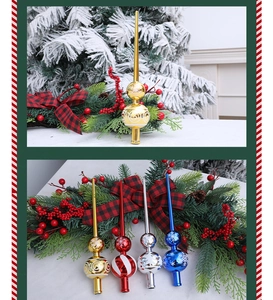 Detailed close-up of colorful plastic Christmas tree toppers in gold, red, and blue colors