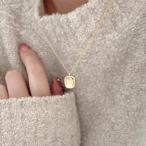 Minimalist 925 sterling silver gold necklace with letter S pendant worn on sweater