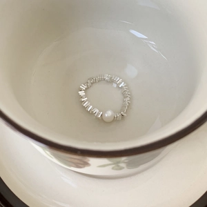 Minimalist 925 sterling silver geometric ring with elegant white pearl on ceramic