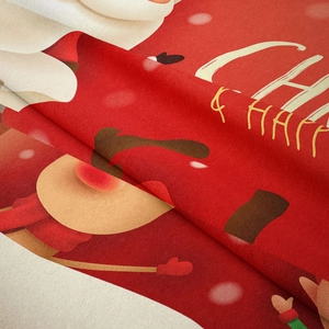 Detailed macro view of soft plush Christmas tapestry with vibrant Santa and deer printing