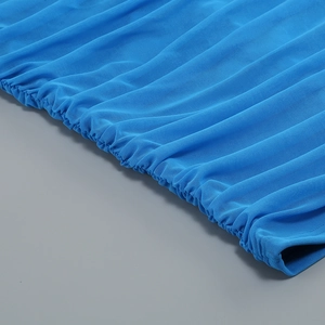 Close-up of ruched elastic blue mesh fabric detailing on a slim-fit off-shoulder dress
