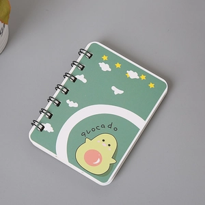 Detail of green A7 coil notebook featuring a cute avocado design on the cover