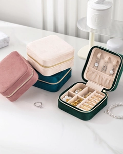Detail view of velvet jewelry organizer with necklace hooks and rings storage compartment