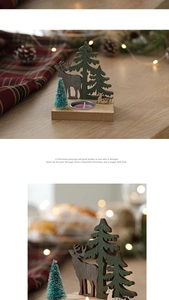 Close-up of Nordic wooden Christmas candle holder with reindeer and forest tree details