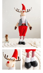Close-up of reindeer plush ornaments with knitted hats and warm home festive decor