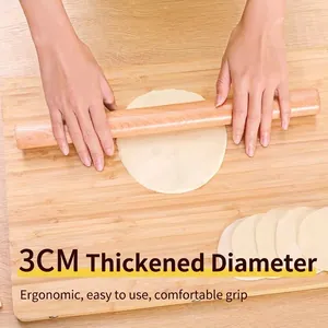 Solid wood rolling pin with 3cm diameter used for rolling dough on a board