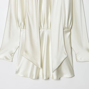 Elegant pearl white satin dress with long sleeves and a draped scarf neckline design