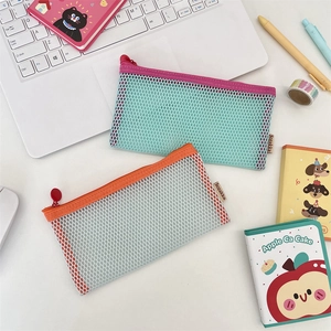Detail of breathable mesh pencil case with zip closure and minimalist brand label