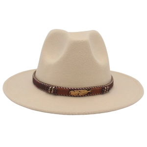 Detail of beige fedora hat with bohemian decorative band and gold feather pendant