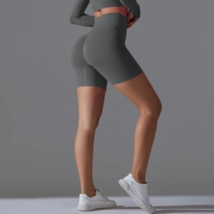 Detail of high-waisted seamless dark grey yoga shorts with supportive ribbed texture