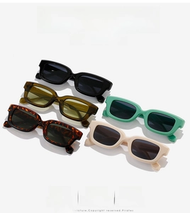 Detail of square candy color sunglasses showing five frame colors and thick acetate texture