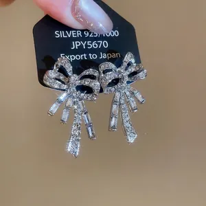 Sparkling S925 silver bow tassel earrings with micro diamonds and pearl accents