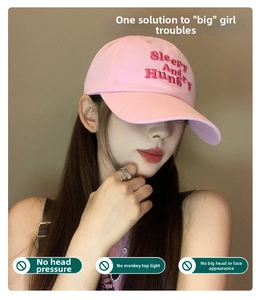 Close-up of pink cotton baseball cap featuring Sleepy And Hungry embroidery and soft crown