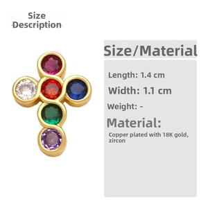 Detail of 18K gold plated cross earring with vibrant colored cubic zirconia stones