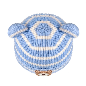 Blue and white striped knit baby beanie with cute bear patch and small ear accents