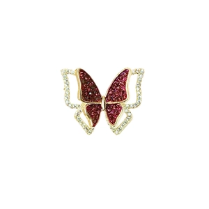 Exquisite golden butterfly brooch with red gemstones and sparkling zircon accents