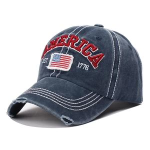 Vintage washed navy blue baseball cap with America embroidery and distressed ripped brim