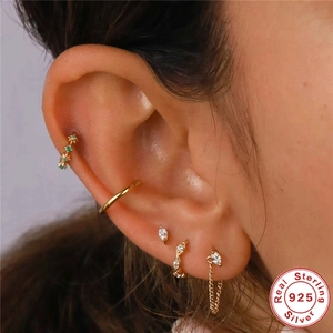 S925 sterling silver ear cuff set with emerald zircon and gold plating on model