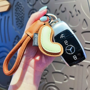 Creative handmade leather letter keychain with green charm on car key