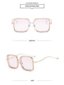 Detail view of pink oversized square sunglasses with elegant gold metal curved temples