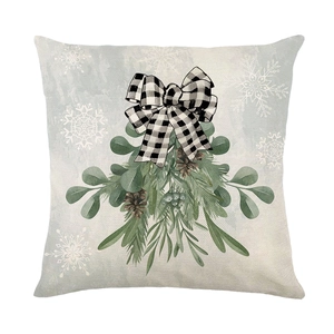 Christmas pillow cover with mistletoe leaves and buffalo plaid bow decoration