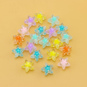 Macro shot of colorful star-shaped resin beads for DIY jewelry making accessories