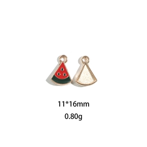 Detail of 11x16mm alloy watermelon slice charms with red enamel and gold back