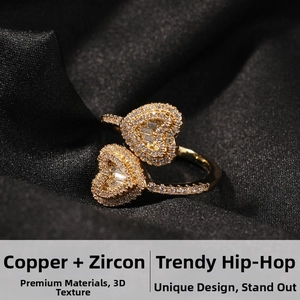 Close-up of double heart hip hop ring with gold-plated copper and pavé zircon stones