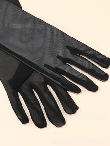 Detailed close-up of semi-transparent black mesh fabric texture on long elegant gloves