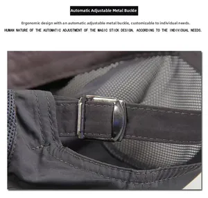 Detailed view of the adjustable silver metal buckle and strap on the dark gray sports cap