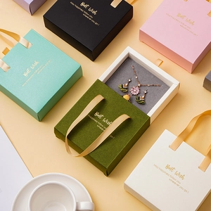 Elegant drawer jewelry gift boxes with ribbon handles in multiple colors and gold foil text