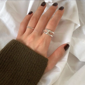 925 sterling silver double-layer H-shaped open ring set on hand with green sweater