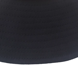 Macro detail of multi-row stitching on black cotton canvas sun hat brim for durability