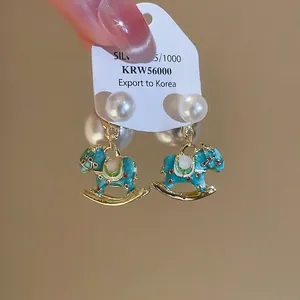 S925 silver rocking horse earrings with enamel finish and pearl drop detail