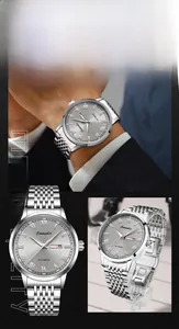 Detailed macro view of silver stainless steel automatic watch with dual day-date display