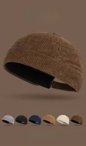 Detail showing high-quality corduroy texture and adjustable strap on a retro brimless docker cap