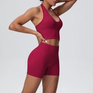Detail view of ribbed knit yoga set featuring a halter bra and high waist shorts