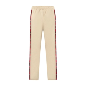 Detail of plaid side stripes on khaki casual trousers with premium fleece texture