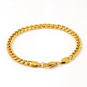 18K gold-plated stainless steel Cuban link bracelet for men and women on white background