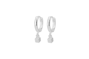 Macro view of sterling silver hoop earrings with geometric square cube pendant