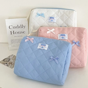Quilted bow makeup bag set in macaron colors featuring a soft portable vanity design