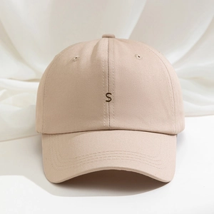 Classic beige cotton baseball cap featuring dark S letter embroidery and adjustable strap