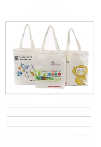 Detail of white cotton canvas tote bags showing various floral and cartoon prints